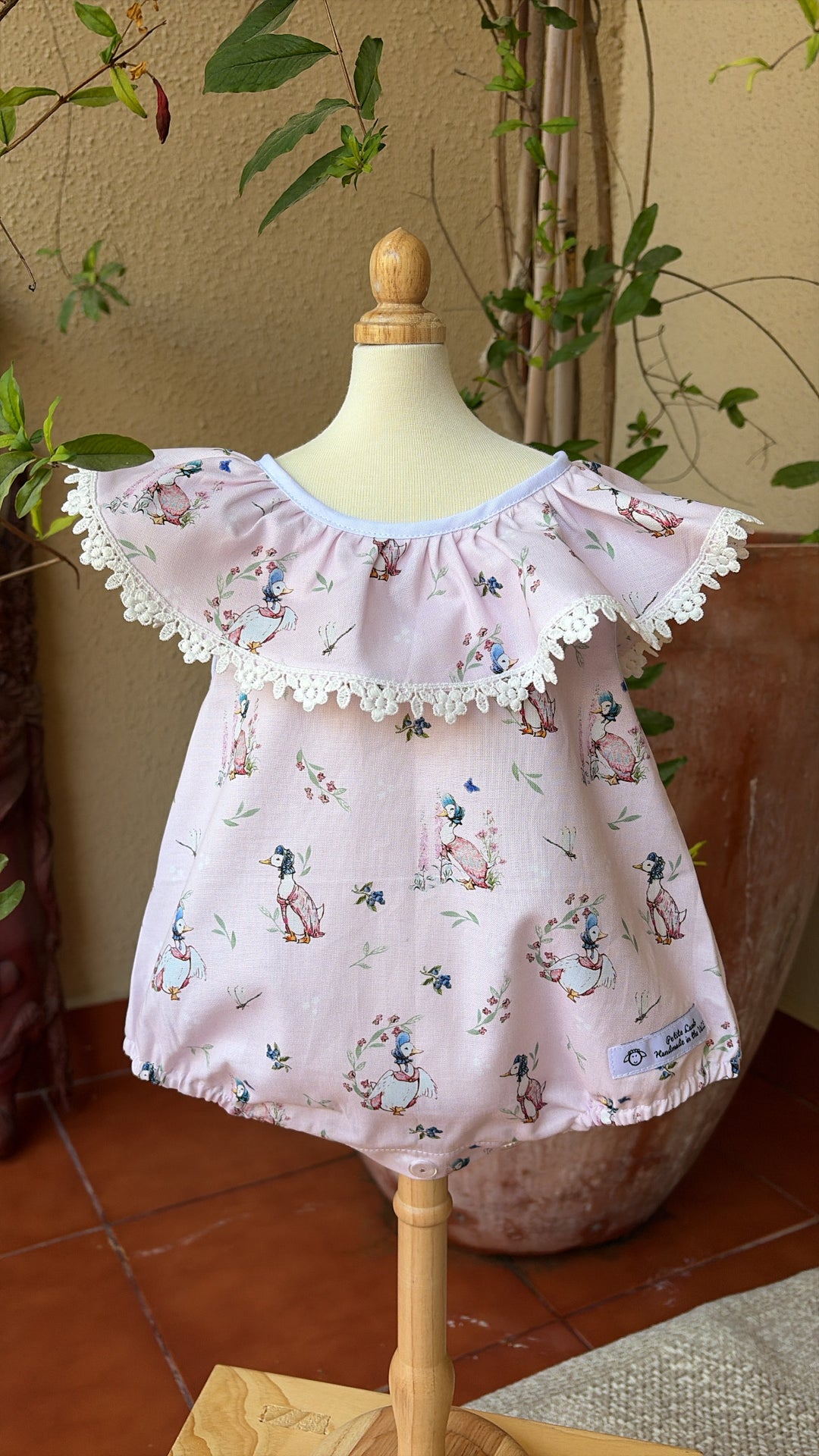 Puddle duck ruffle collar romper
