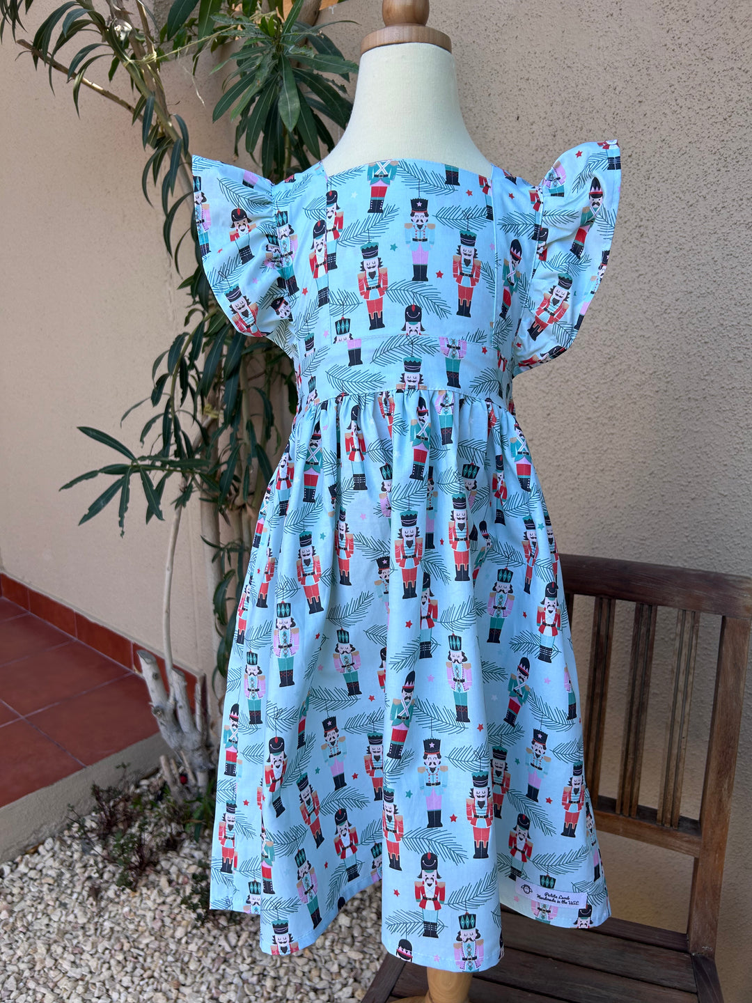 Nutcracker in grey/green flutter dress